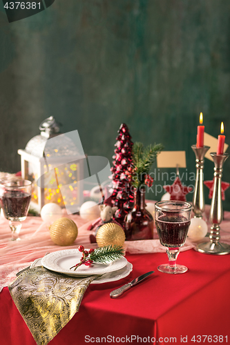 Image of Beautiful Christmas table setting with decorations