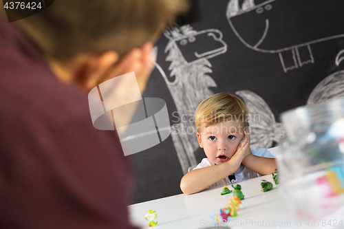 Image of Cute little toddler boy at child therapy session.