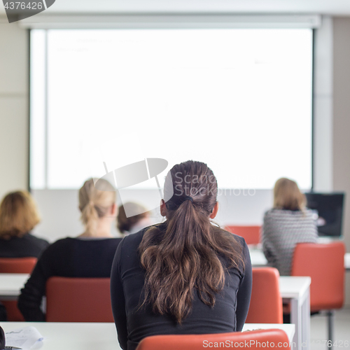 Image of Audience in the lecture hall listening to academic presentation.