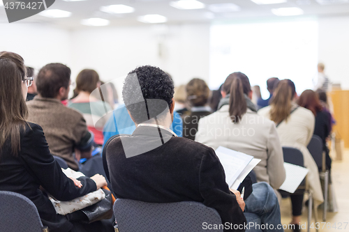 Image of Woman giving presentation on business conference.