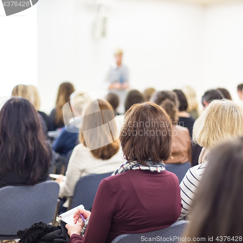 Image of Woman giving presentation on business conference.