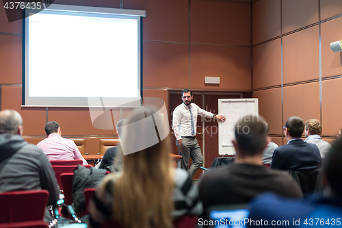 Image of Speaker Giving a Talk at Business Meeting.