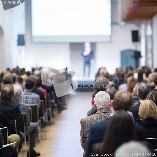 Image of Business speaker giving a talk at business conference event.