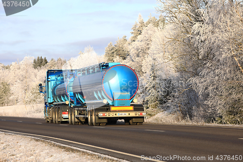 Image of Blue Tank Truck on Winter Highway