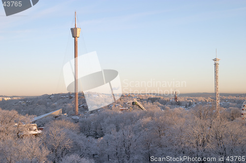 Image of Winter morning: colourful, beautiful panorama sunrise with snow and buildings, Liseberg tower, downtown G&#246;teborg, Sweden