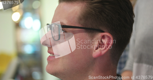 Image of young businessman in startup office