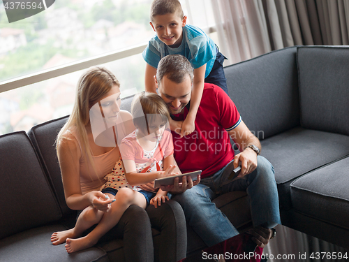 Image of young cuple spending time with kids
