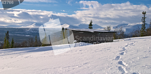 Image of Winter panorama from Lifttoppen, footprints on snow, trees, clouds and a shelter, V&#229;l&#229;dalen, Sweden
