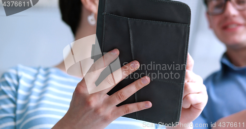 Image of low angle shot of business people using technology