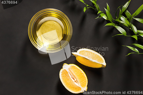 Image of Lemon oil isolated on black table