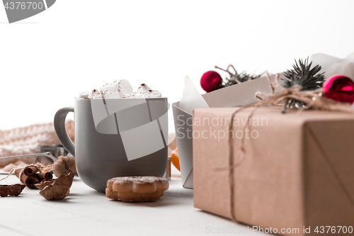 Image of The winter composition. The gifts and cup with marshmallow