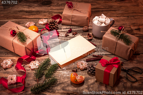 Image of The winter composition. The gifts and cup with marshmallow