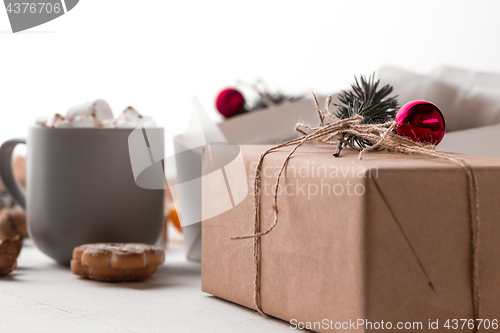 Image of The winter composition. The gifts and cup with marshmallow