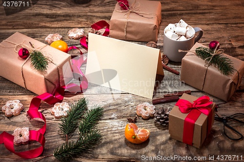 Image of The winter composition. The gifts and cup with marshmallow