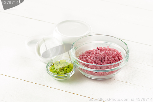 Image of Spa concept with salt, mint, lotion, towel on white background