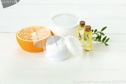 Image of Spa concept with salt, mint, lotion, towel on white background