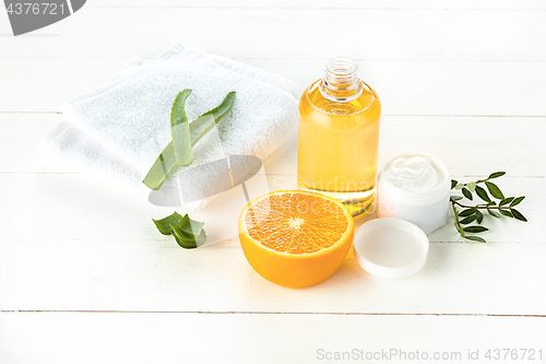 Image of Spa concept with salt, mint, lotion, towel on white background