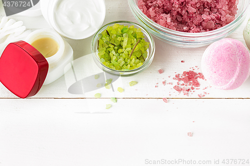 Image of Spa concept with salt, mint, lotion, towel on white background