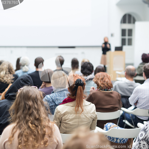 Image of Woman giving presentation on business conference.