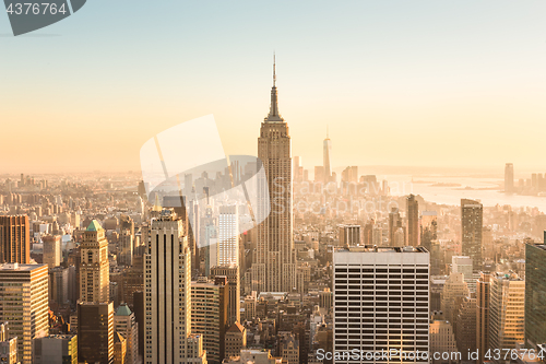 Image of New York City skyline with urban skyscrapers at sunset, USA.