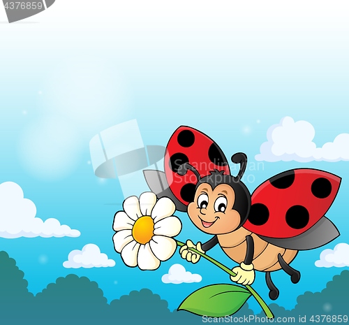 Image of Ladybug holding flower theme image 3