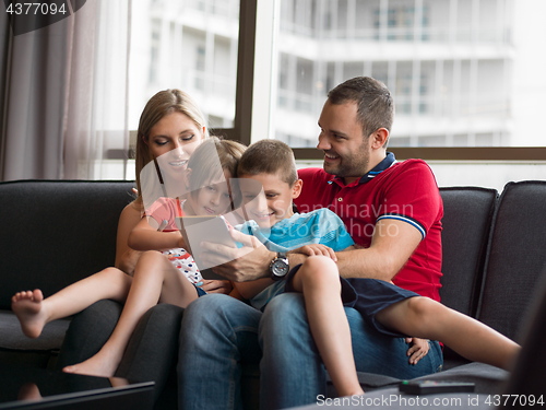 Image of young cuple spending time with kids