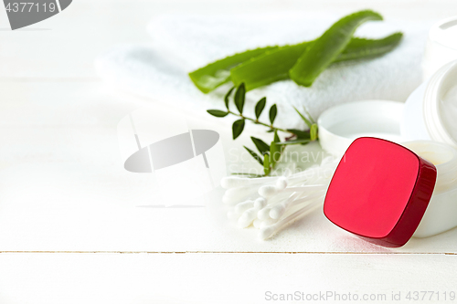 Image of Spa concept with salt, mint, lotion, towel on white background