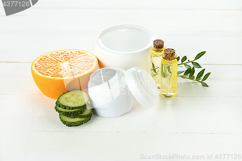 Image of Spa concept with salt, mint, lotion, towel on white background