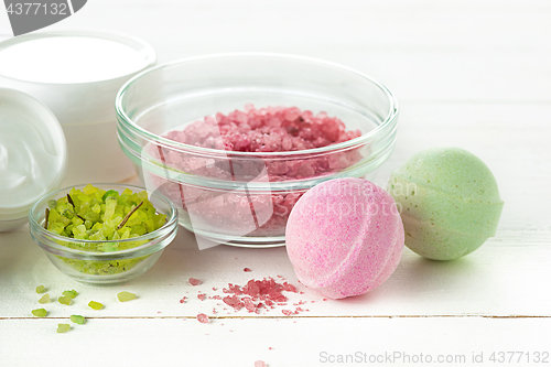 Image of Spa concept with salt, mint, lotion, towel on white background