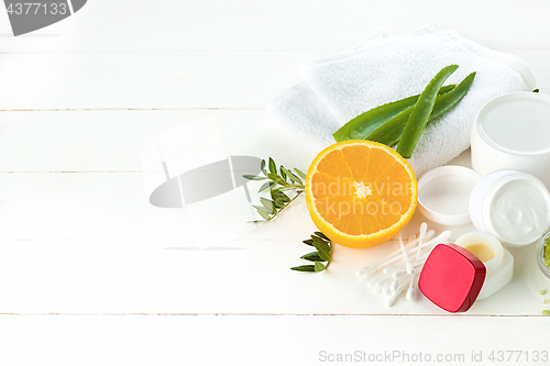 Image of Spa concept with salt, mint, lotion, towel on white background