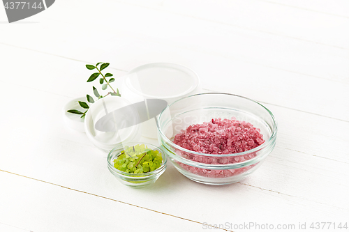 Image of Spa concept with salt, mint, lotion, towel on white background