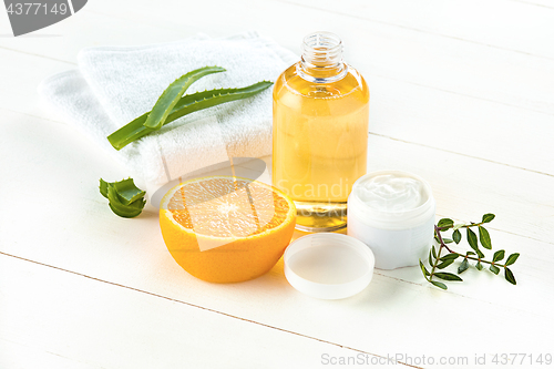 Image of Spa concept with salt, mint, lotion, towel on white background