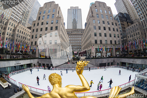 Image of Golden Prometheus statue and Rockefeller Center ice skate rink, Manhattan, New York City, USA.