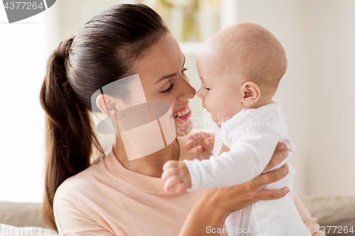 Image of happy mother with little baby boy at home