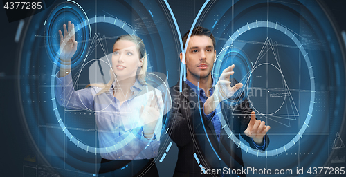 Image of business people using virtual screen projections