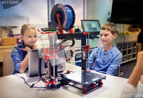 Image of happy children with 3d printer at robotics school