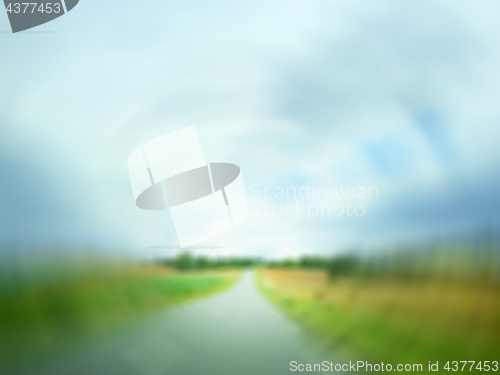 Image of Defocused image of a country road in field