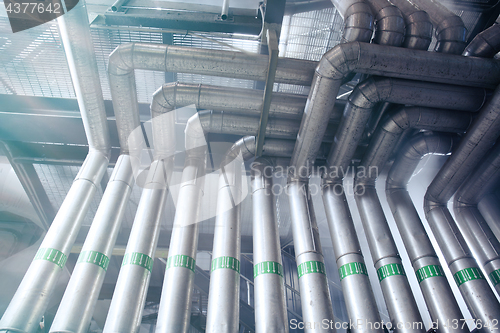 Image of Industrial Steel pipelines, valves, cables and walkways