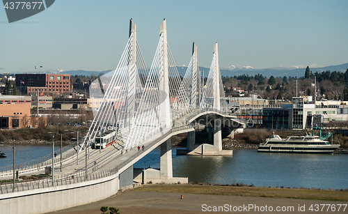 Image of People Move Across Portland Bridge Willamette River Cascade Moun