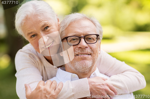 Image of portrait of happy senior couple at park