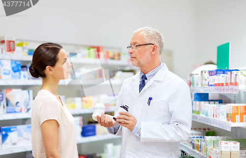 Image of apothecary and woman with drug at pharmacy