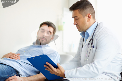 Image of doctor and man with health problem at hospital