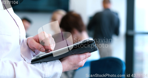 Image of Portrait of  smiling casual businesswoman using tablet  with cow