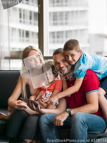 Image of young cuple spending time with kids