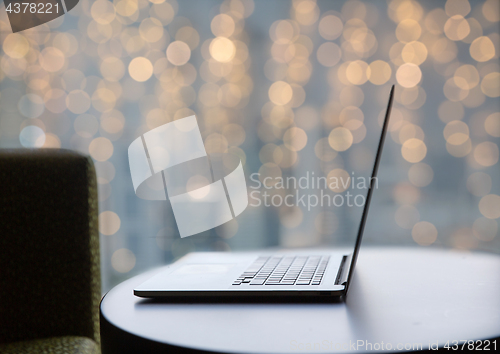 Image of close up of laptop computer on table at christmas