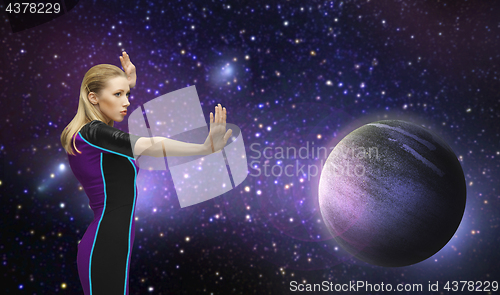 Image of futuristic woman over planet and stars in space