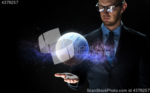 Image of close up of businessman with planet hologram