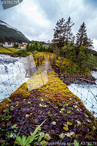 Image of Suspension bridge over the mountain river, Norway.