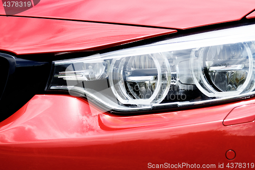 Image of Red sports car headlight