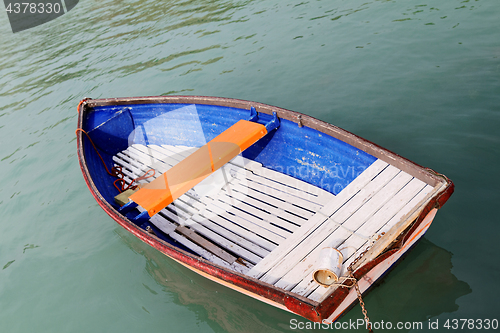 Image of Old wooden boat on the lake